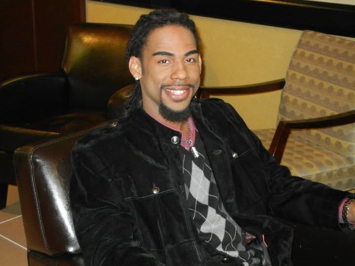 Brian Pernell Watson seated and smiling